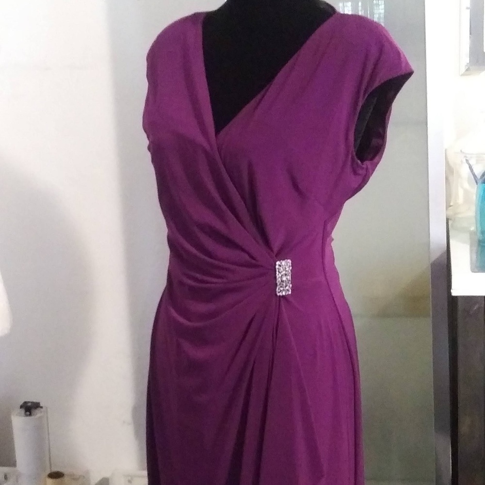 Purple pleated jeweled dress.